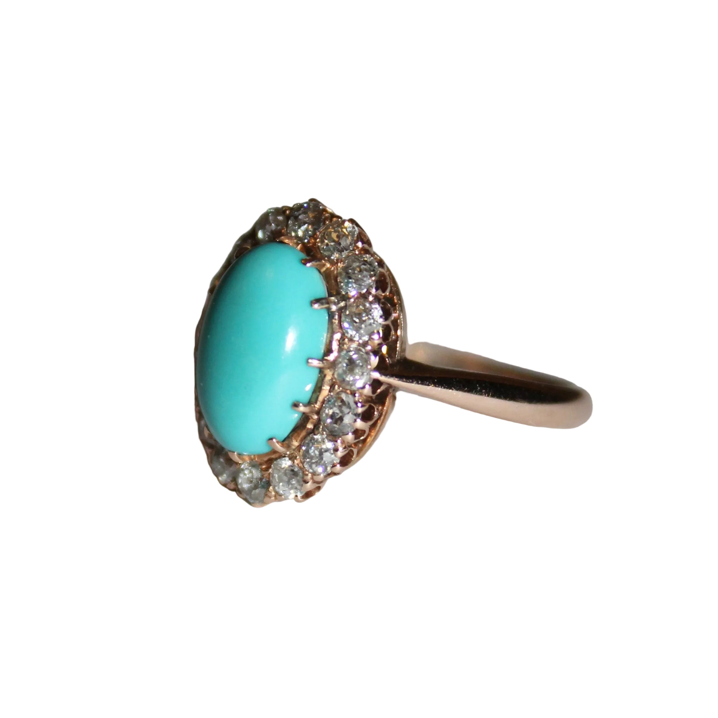 Ring with turquoise stone and diamond accents on a neutral background