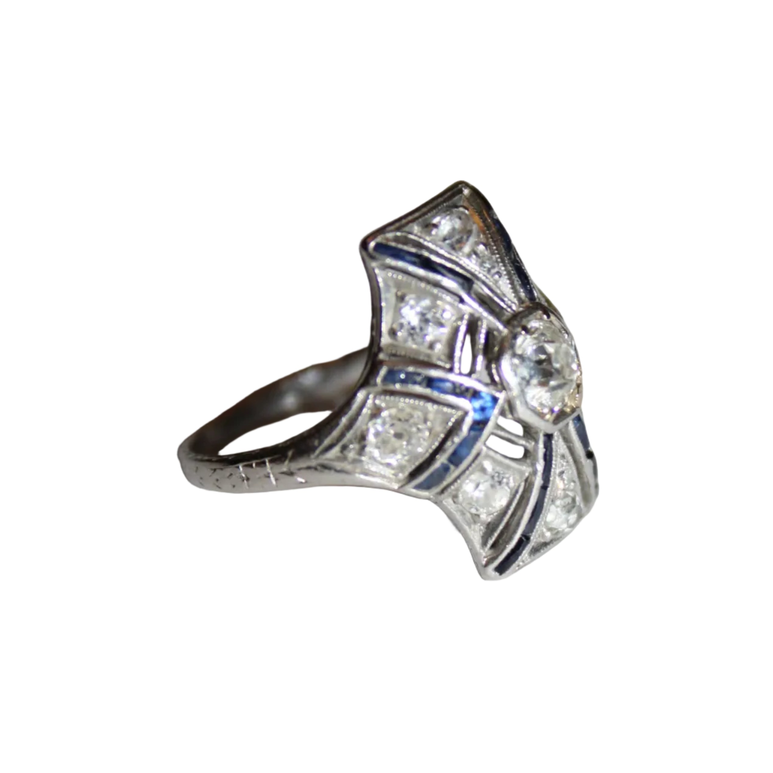 Silver ring with gemstones on a light gray background