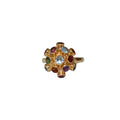 Gold ring with colorful gemstones on a white background