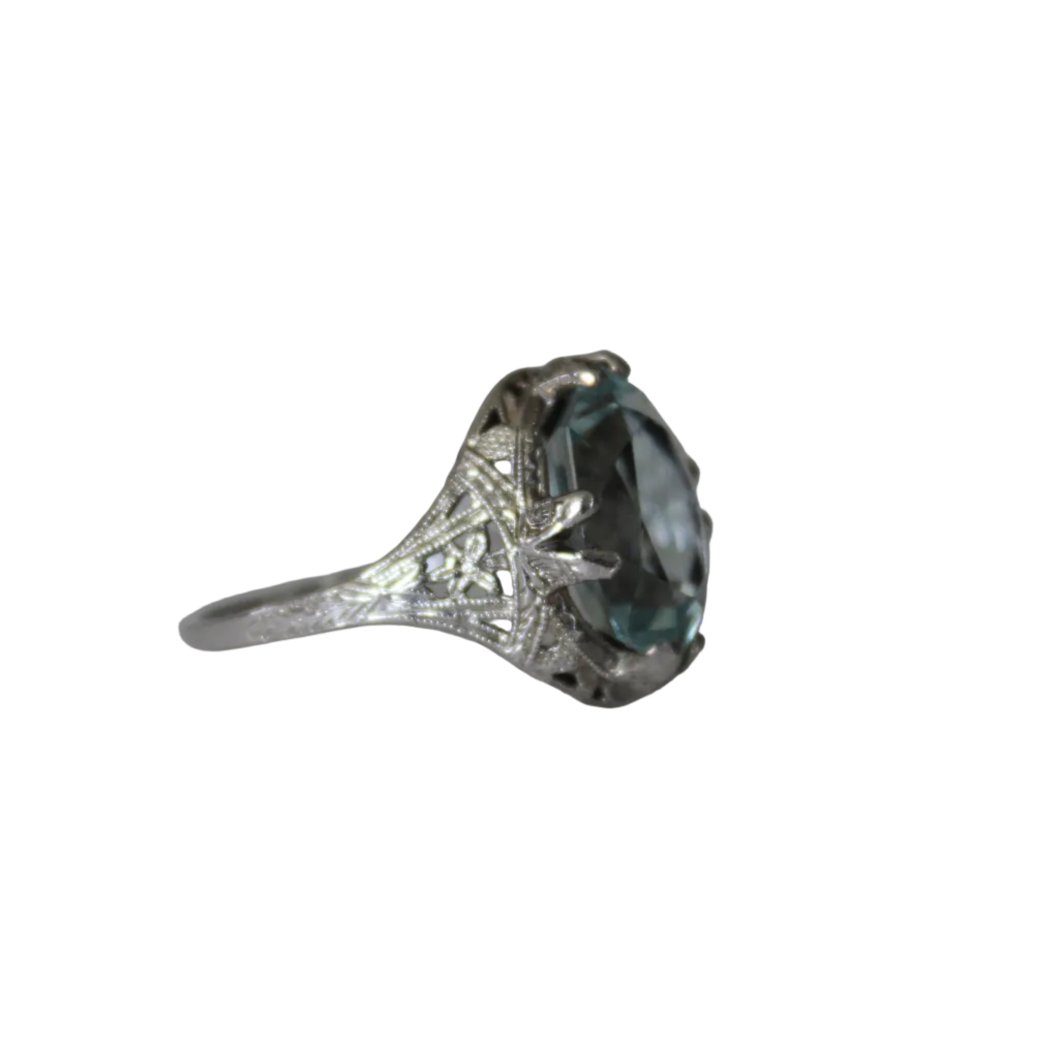 Silver ring with a large blue gemstone on a light gray background