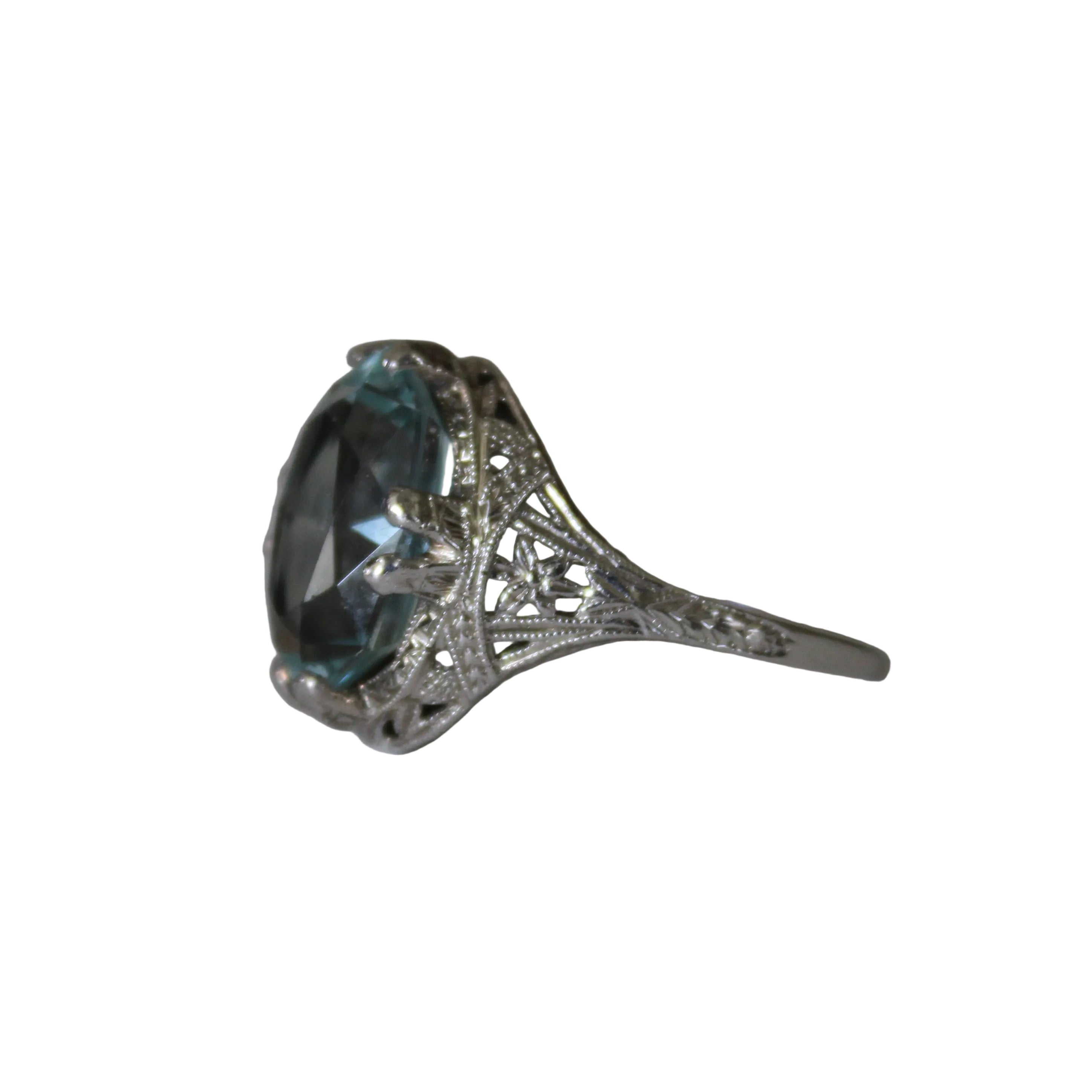 Silver ring with a large blue gemstone on a white background